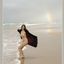 Bib boobed babe showing her body on the beach