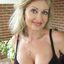 Big boobs mature lady teasing the cam in a solo gallery