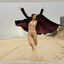 Bib boobed babe showing her body on the beach