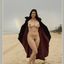 Bib boobed babe showing her body on the beach